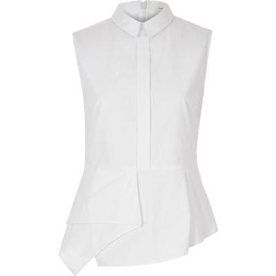 White sleeveless peplum shirt